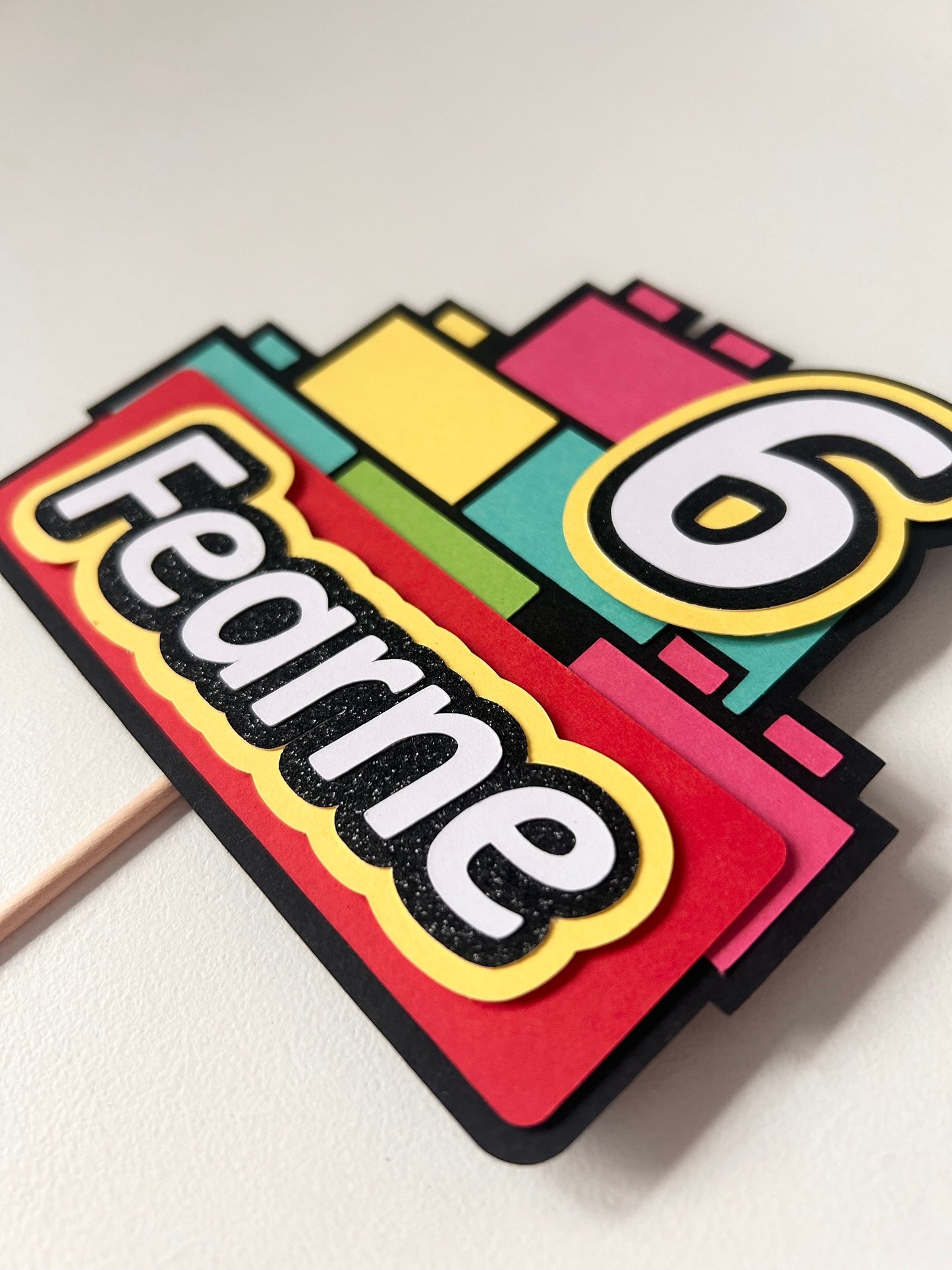 Pink building block cake topper