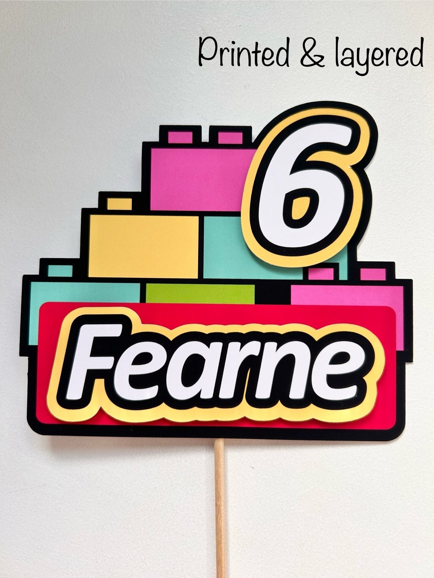 Pink building block cake topper
